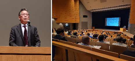 挨拶する技術委員長と会場の様子